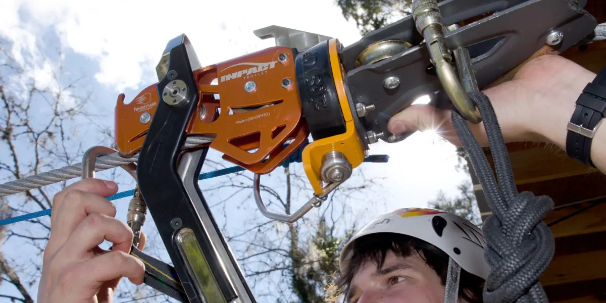 Proper Zip Line Pulley and Trolley Inspection prevents accidents. Find out how to spot deformation, sharp edges, and bearing wear on your equipment.