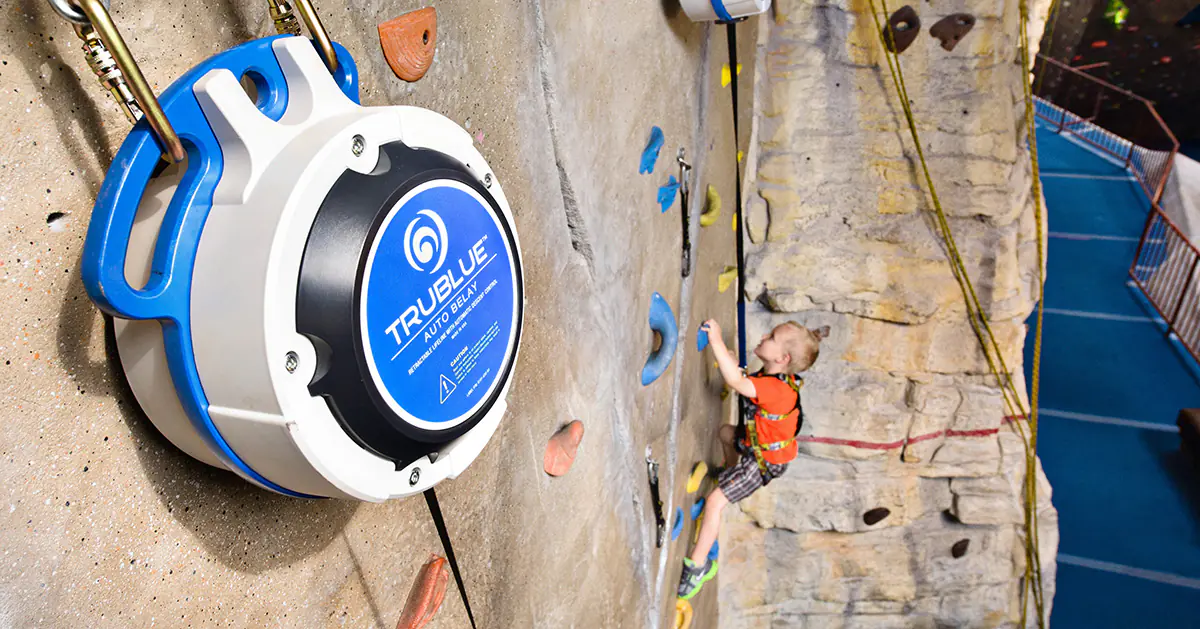 Managing chaos? TRUBLUE is the ultimate FEC auto belay solution, safely handling jumps and high volumes with fewer staff. See how it works.